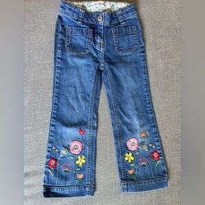 Mini Boden boot cut jeans with floral appliqué